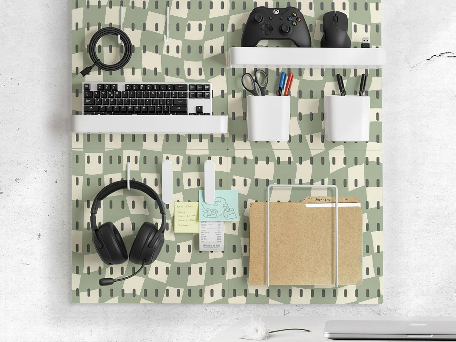 Black and white checkered pegboard wall organizer with panels, containers, shelves, clips, hooks, and a letter holder.