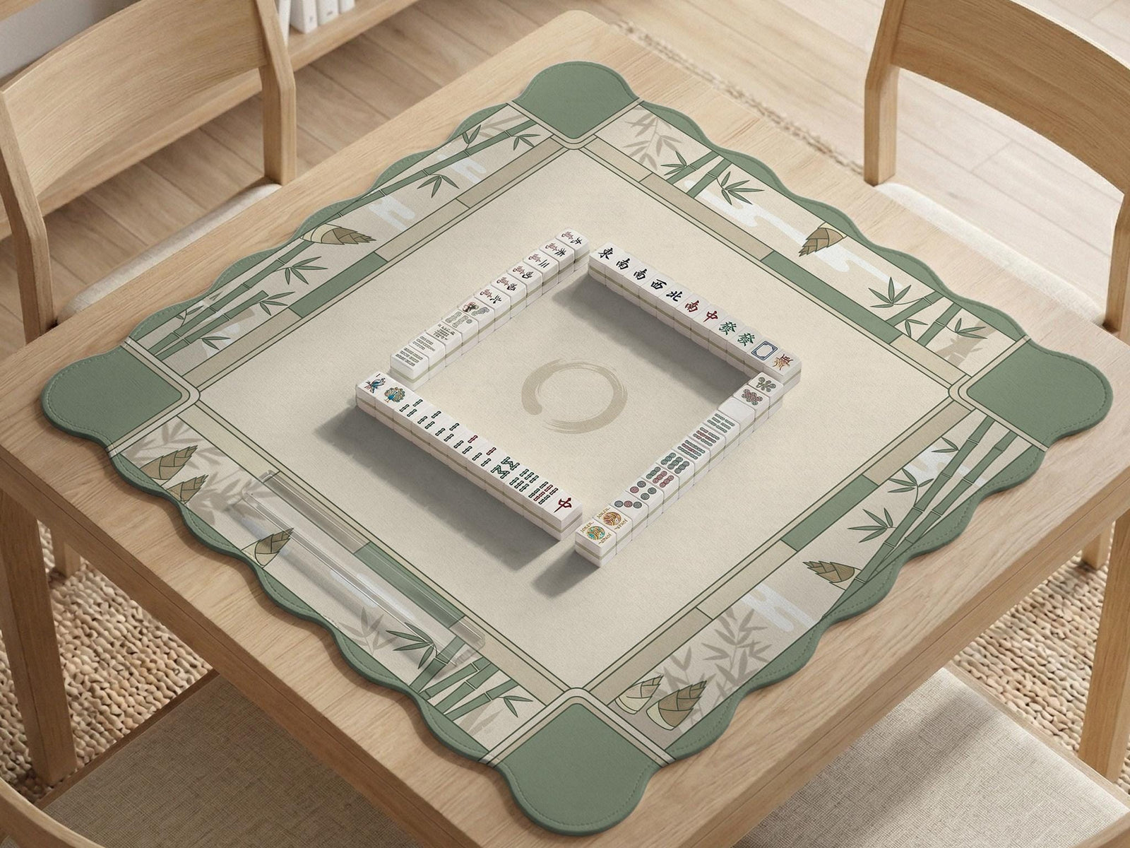 Sage green mahjong mat with a bamboo design and a light center area, shown as a square tabletop game mat.