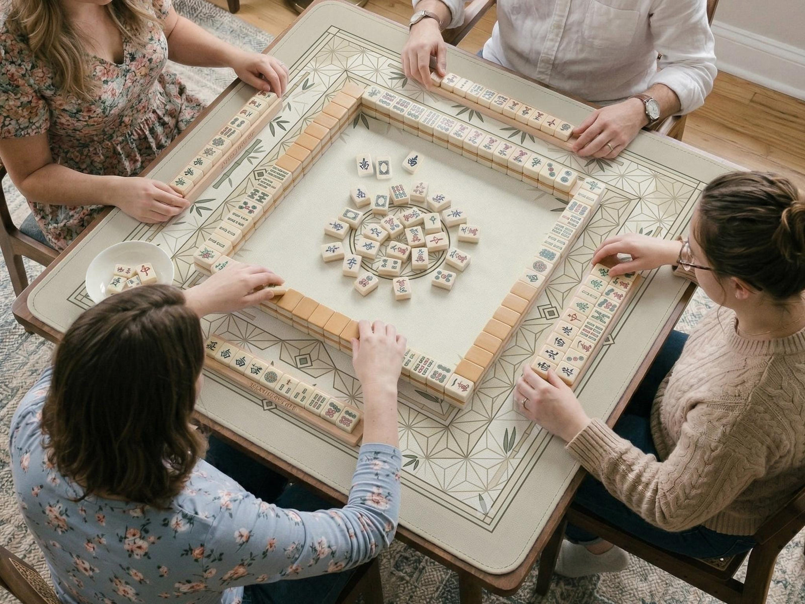 Square mahjong mat with a bamboo and geometric pattern in cream, beige, and sage tones.