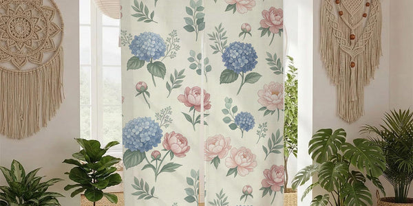 Floral noren curtain with pink peonies and blue hydrangeas on a cream background, shown as a split doorway curtain.