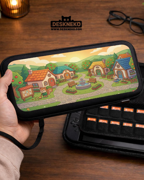A Switch carrying case with a cottagecore village design showing small houses, winding paths, fruit trees, and animal figures in warm colors.