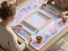 A square mahjong table mat with pastel jellyfish, stars, shells, and bubble details around the border and an open center.