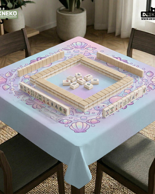 Pastel ocean-themed mahjong mat with jellyfish, bubbles, and shell details on a soft blue background.