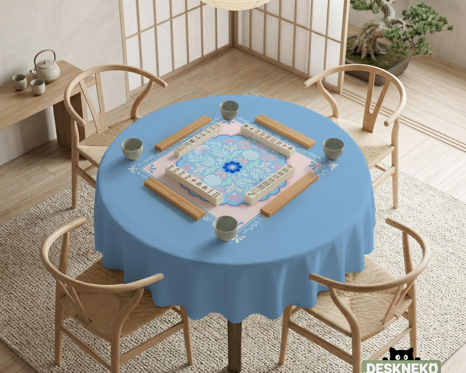 Pastel blue and pink floral square table cover with a scalloped center medallion and ornamental border.