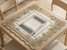 Square beige mahjong mat with bamboo frame details and botanical styling