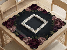 A floral mahjong mat with a dark background and peony border in burgundy, blush, olive, and cream tones.