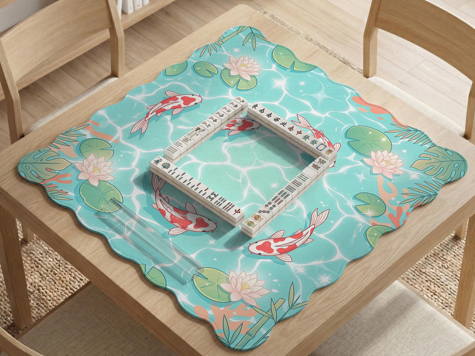 Square mahjong playing mat with aqua background, coral accents, floating lily pads, and koi fish circling the play area.