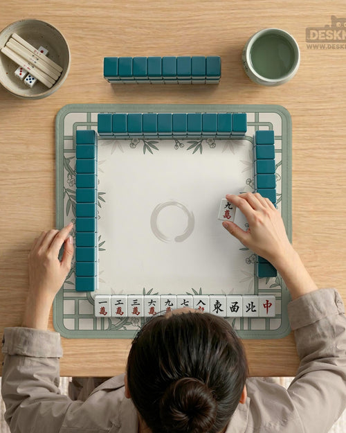 Square sage green mahjong mat with a bamboo and floral border and an open center.
