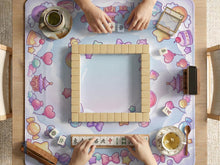 Square pastel mahjong table mat with bows, stars, moons, sweets, and small kawaii-style details.