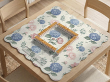 Square mahjong mat with a pink peony and blue hydrangea floral print on a light background.
