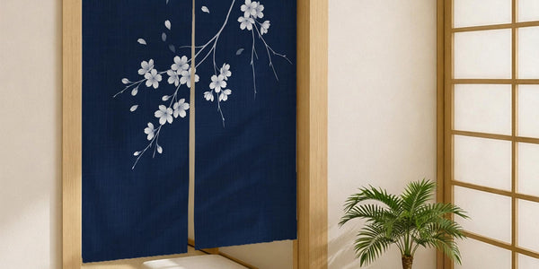 Navy door curtain with pink cherry blossom branches and a light floral layout on a dark background.