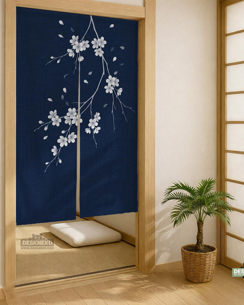 Navy door curtain with pink cherry blossom branches and a light floral layout on a dark background.
