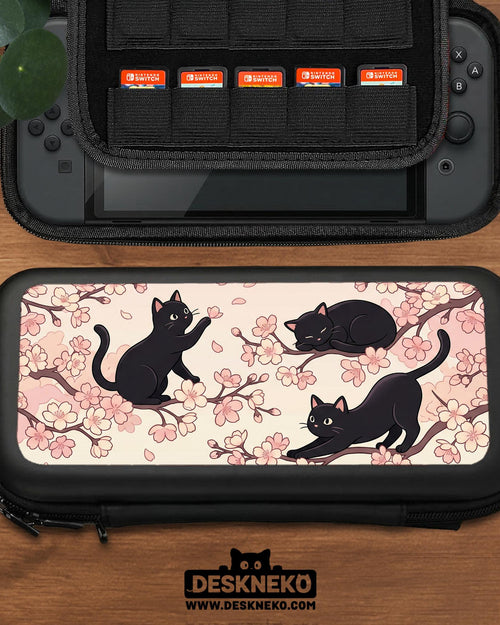 Pink Switch carrying case with a cherry blossom and black cat print on the front.