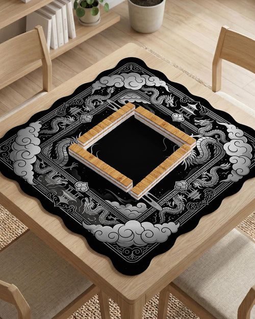 Square mahjong table mat with a black and silver dragon border, cloud details, and a scalloped edge.