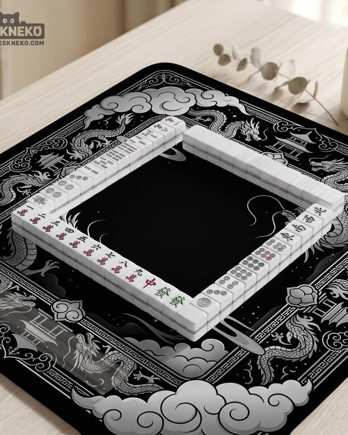 Square black mahjong mat with a dragon illustration in the center and a silver cloud border around the edges.