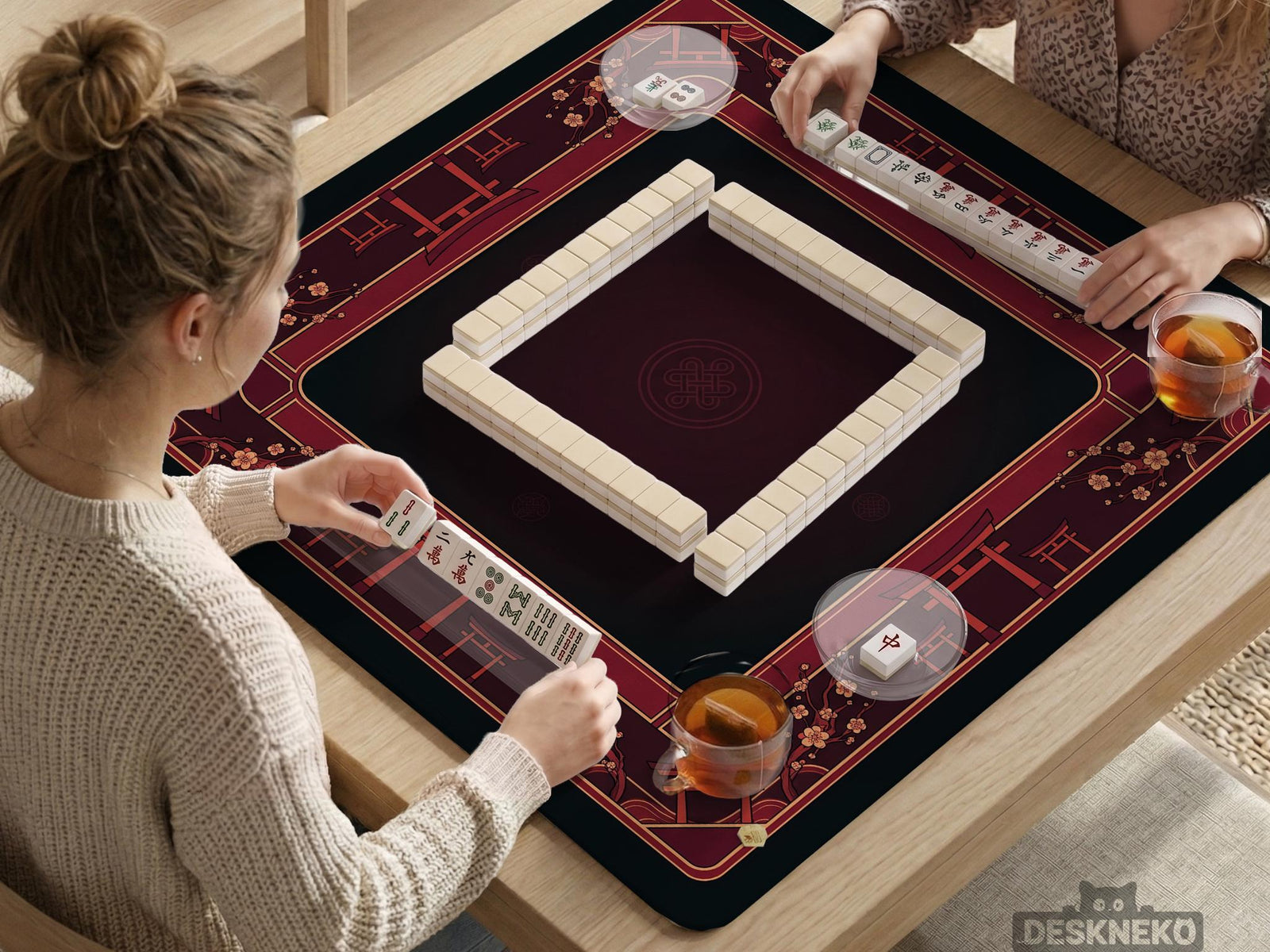 Square burgundy mahjong mat with a cherry blossom floral border and a dark open center.