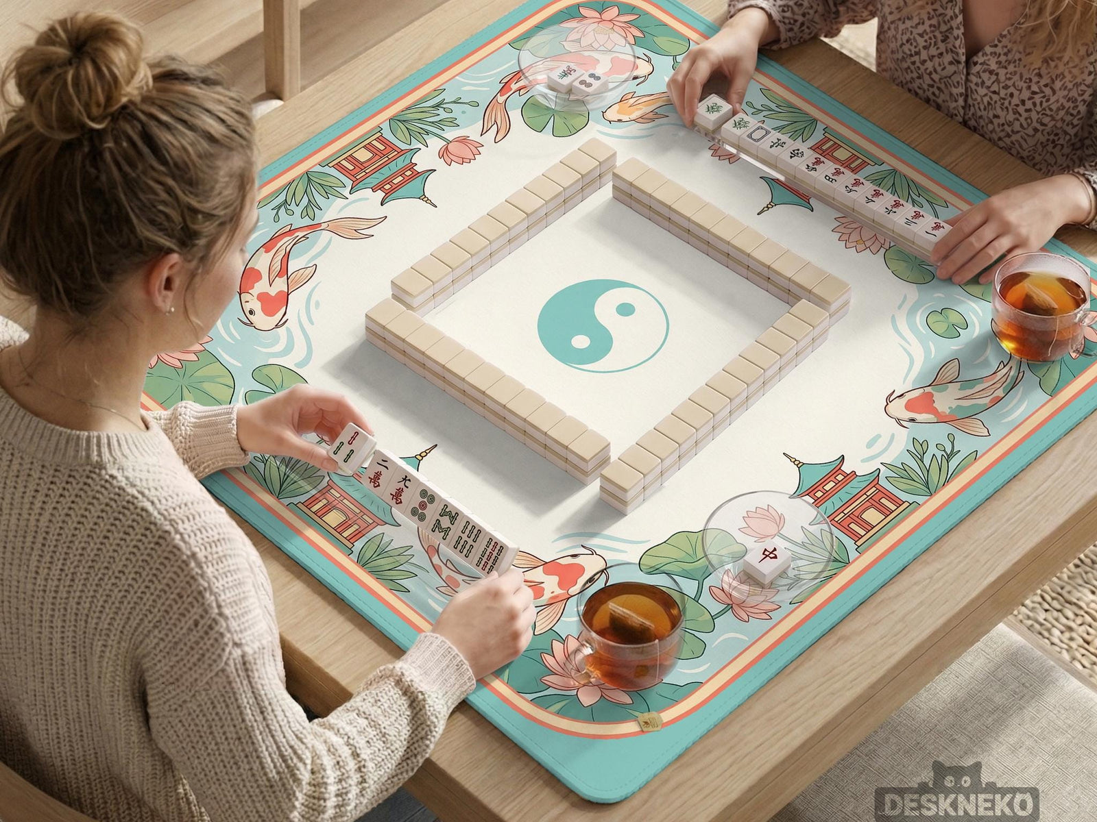 Pastel mahjong mat with a koi fish and lotus pond design, pagoda details, lily pads, and curved water lines.