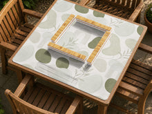 Square mahjong table mat with a sage green botanical design, abstract leaf shapes, and a soft neutral background.