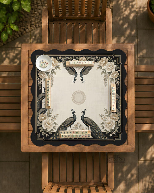 Square ivory mahjong mat with a black peacock border, cream flowers, and gold accent details.