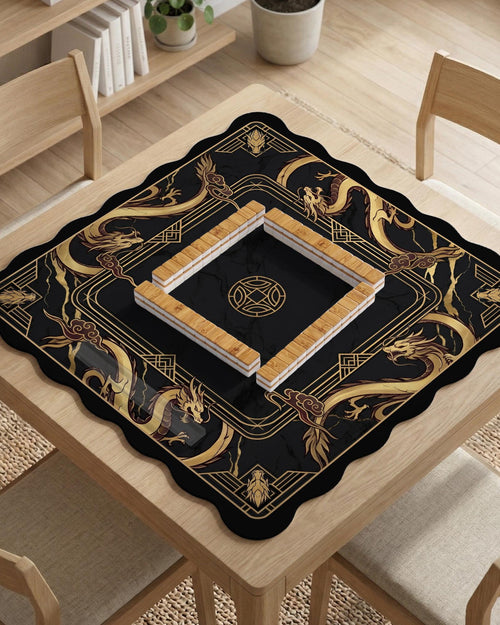 Black mahjong table mat with a gold dragon border, gold geometric corner details, and a clear center play area.