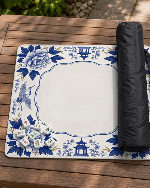 Square mahjong mat with a blue porcelain-style border, floral corner designs, crane details, and a plain center area.