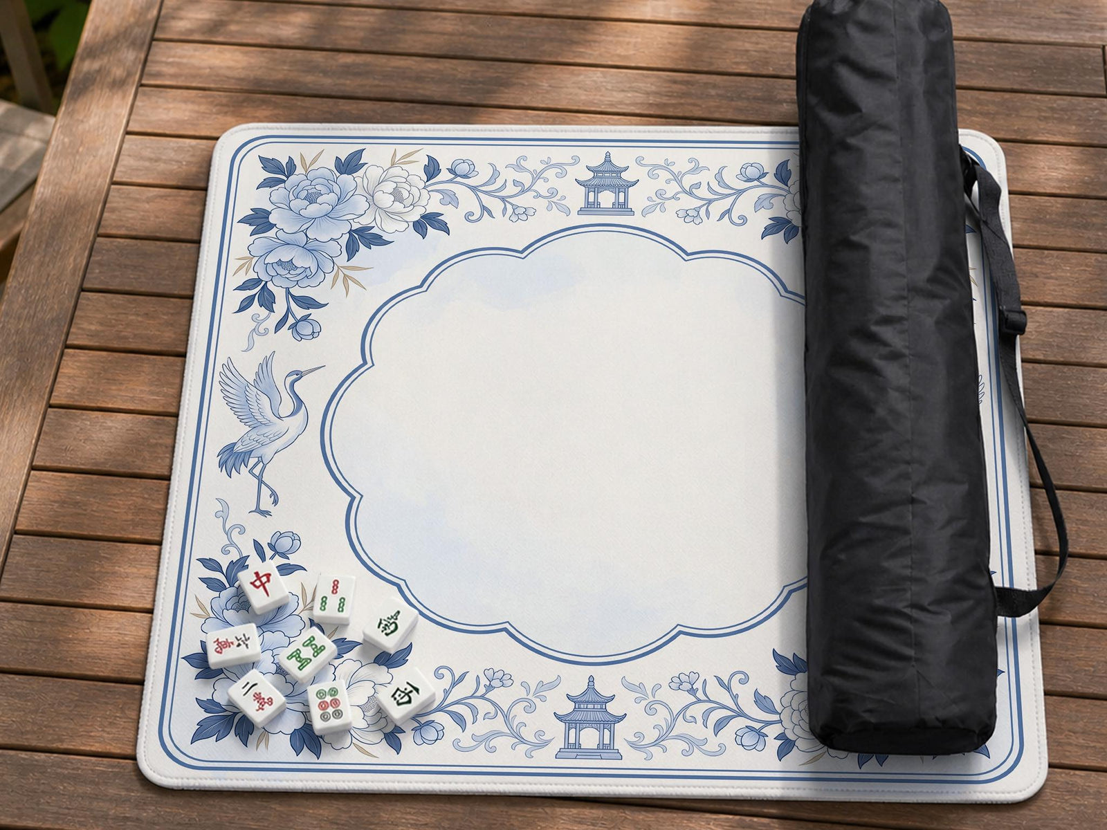 Blue mahjong mat with a chinoiserie-style floral pattern and decorative border.