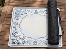 Blue mahjong mat with a chinoiserie-style floral pattern and decorative border.