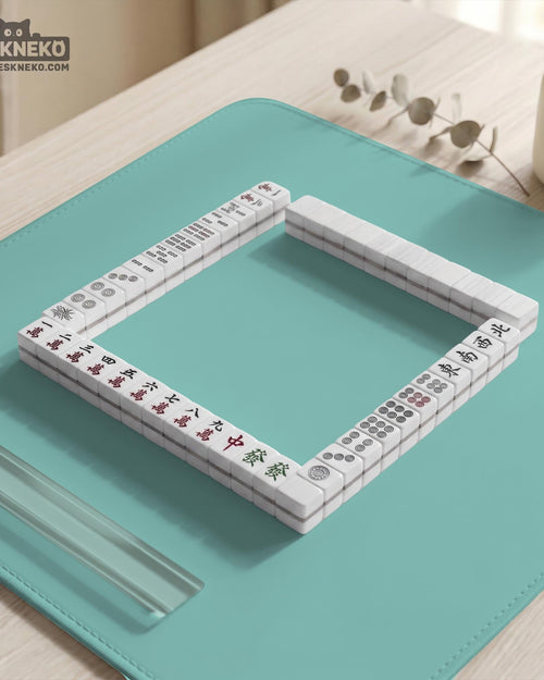 Solid aqua square mahjong mat with a scalloped edge.