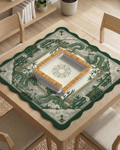 Green mahjong table mat with a dragon design, bamboo graphics, and a cloud border around an open center.