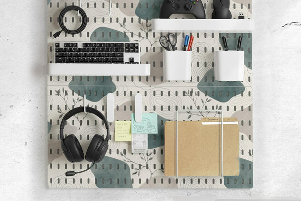 Four pegboard panels in sage green with cream, grey, teal, and leafy botanical artwork arranged in a square layout.