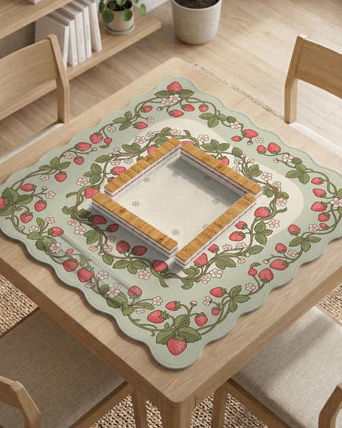 Square mahjong mat with a strawberry floral pattern, sage green background, pink berries, and leafy vines, with a blank center area.