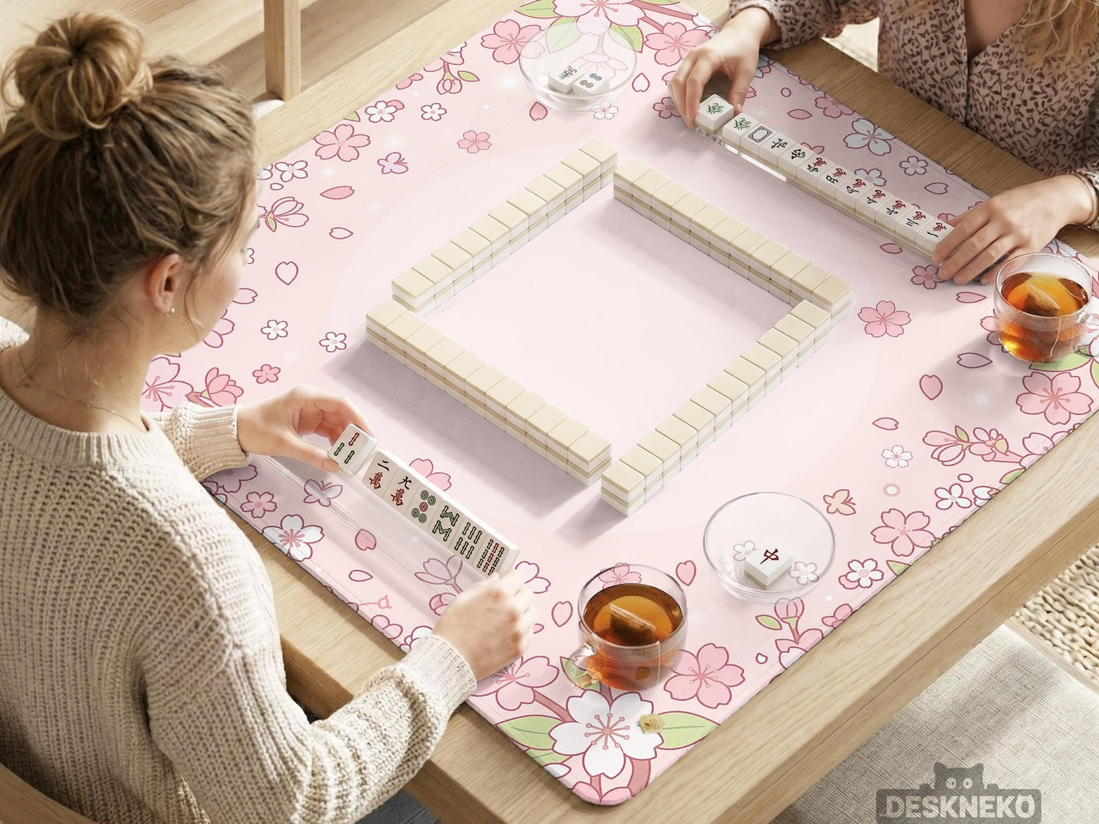 Pink square mahjong mat with a sakura flower border and a lighter center area.