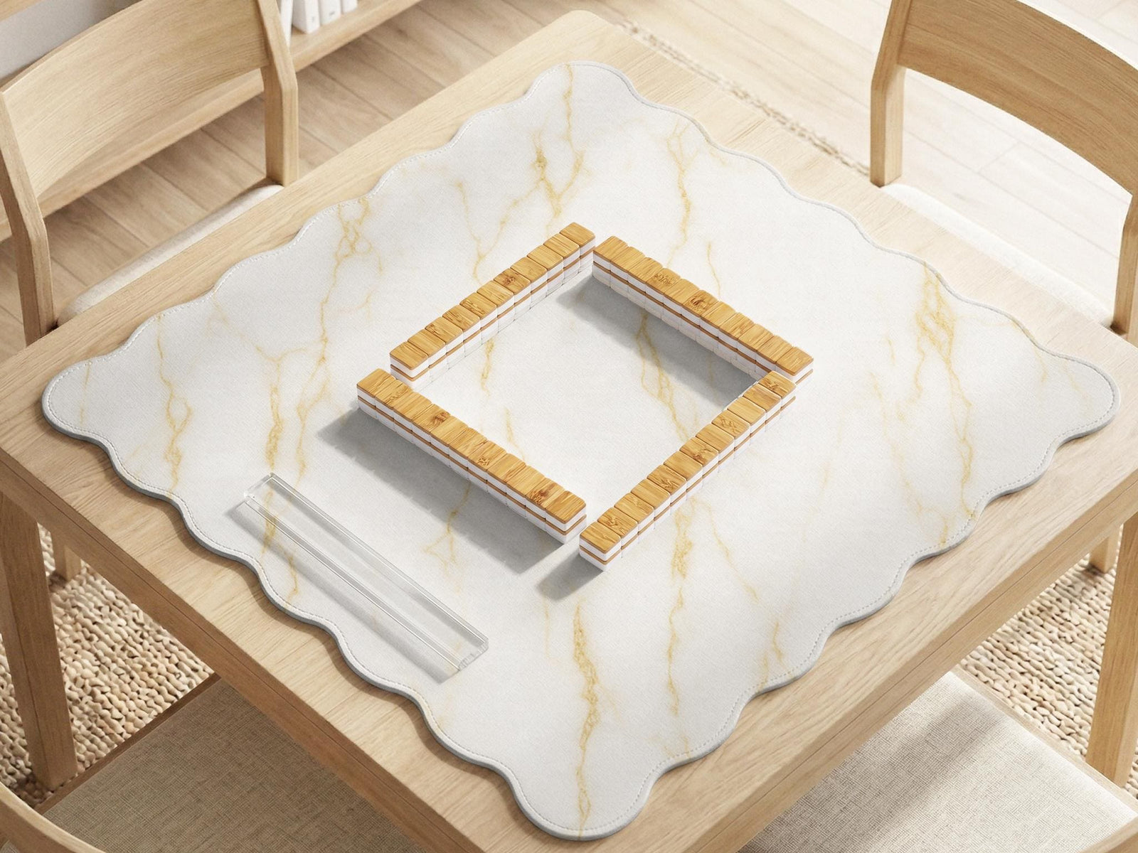 White marble mahjong mat with gold veining and a scalloped decorative edge.