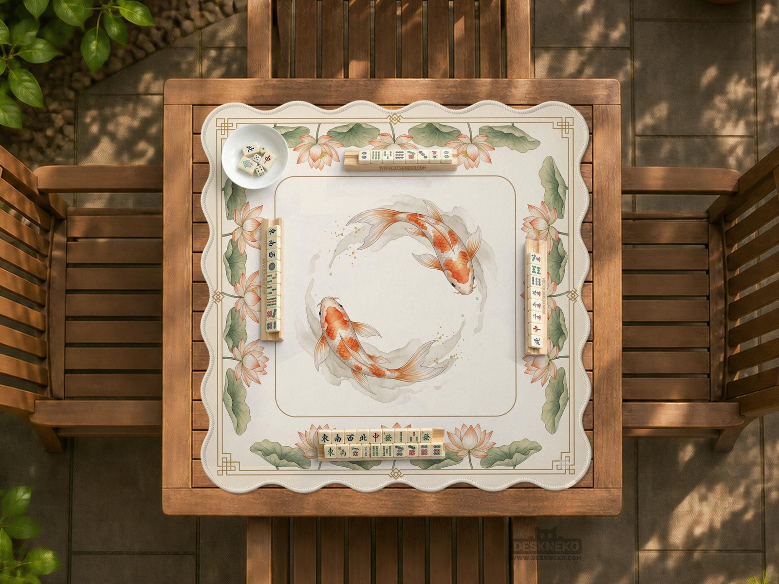 A cream mahjong mat with orange koi fish, sage lotus leaves, and a thin gold border.