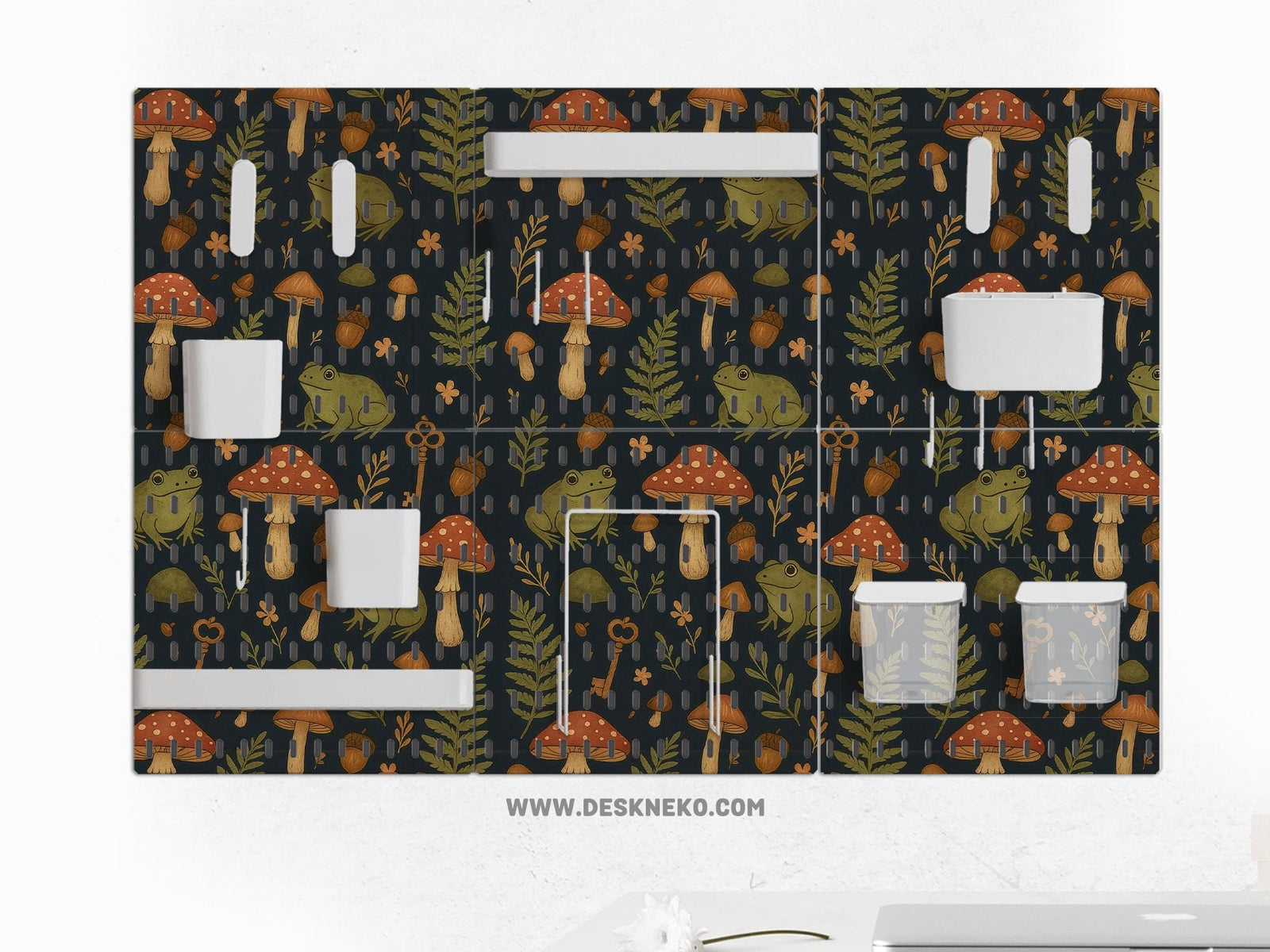 Six pegboard panels with a dark woodland frog and mushroom design, plus hooks, shelves, containers, clips, and a folder holder.