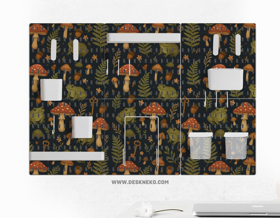 Six pegboard panels with a dark woodland frog and mushroom design, plus hooks, shelves, containers, clips, and a folder holder.