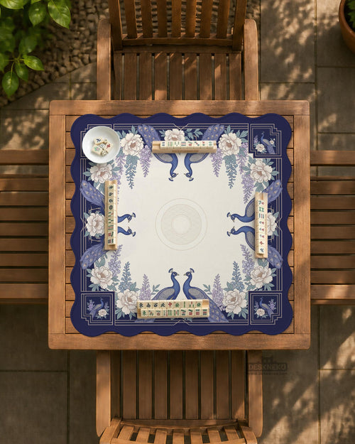 Blue mahjong table mat with a peacock and floral border, ivory center, lavender flowers, and scalloped edges.