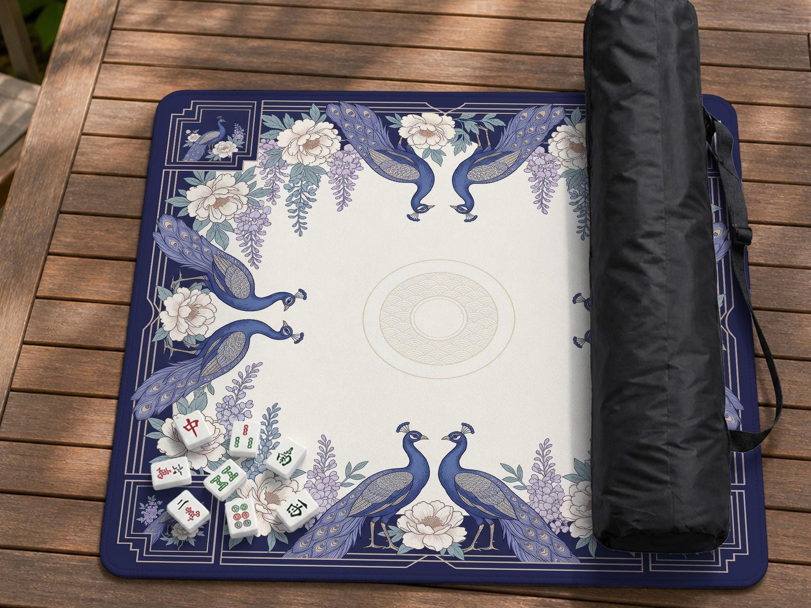 Blue mahjong mat with a floral peacock border and an open center area for tile play.