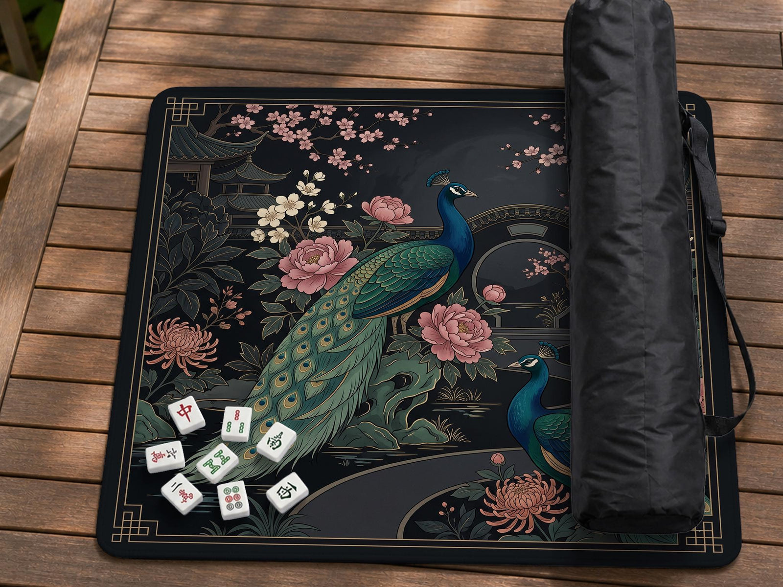 Square black mahjong mat with a gold peacock, blush flowers, dark botanical details, and a gold border.
