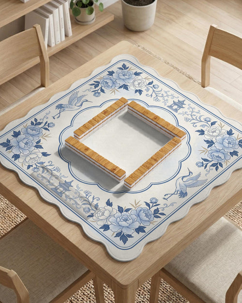 Square mahjong mat with a blue chinoiserie floral pattern on a light background.