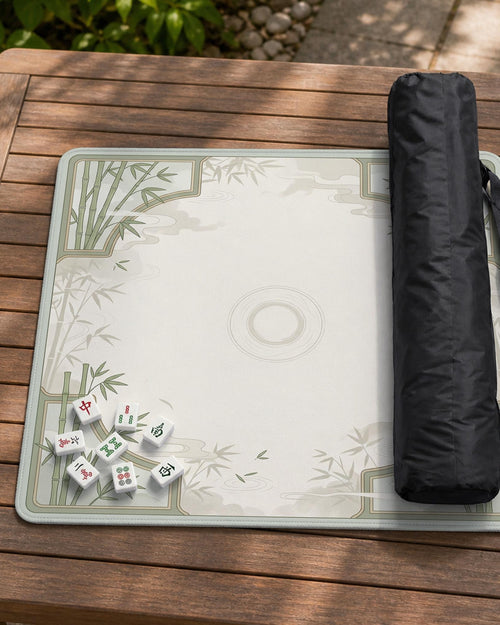 Square light green mahjong mat with bamboo stalks, soft ivory details, botanical shadows, mist lines, and a circular center design.