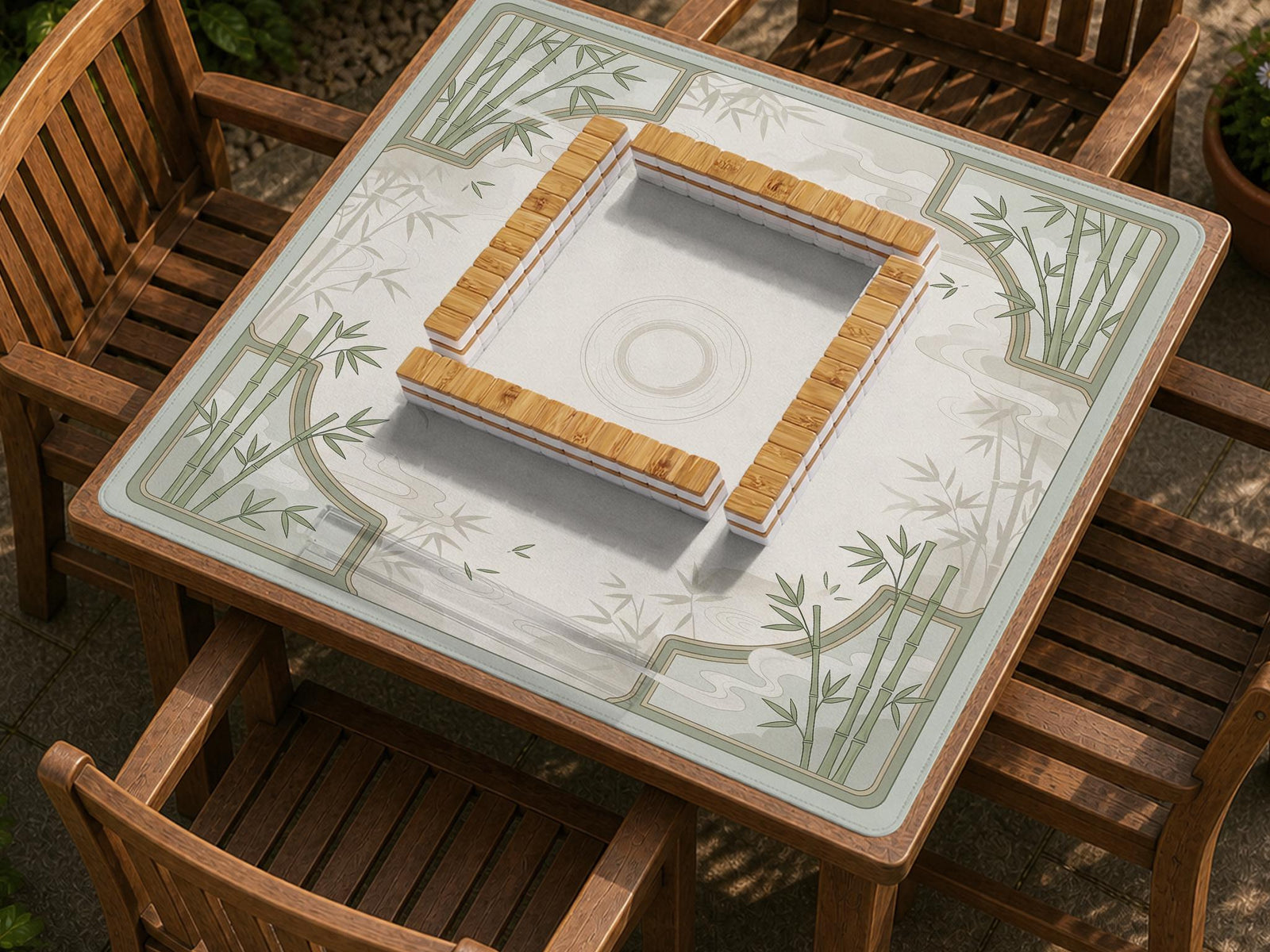 Square mahjong table mat with a pale cream center and green bamboo chinoiserie corners and border.