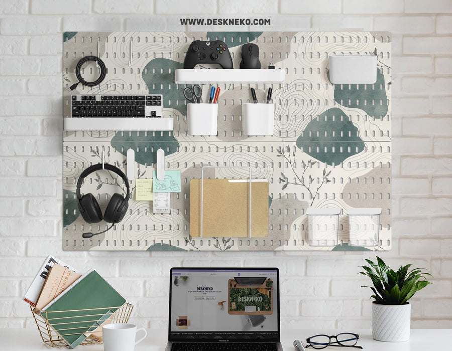 Four square pegboard panels in muted sage green, warm cream, and grey with contour lines and small botanical branch details.