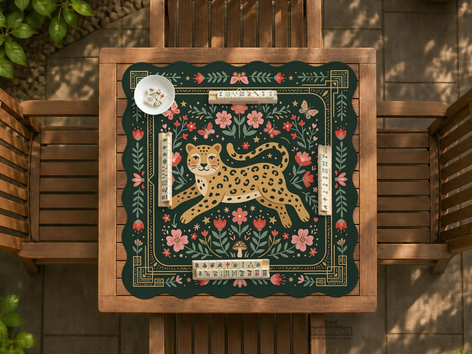Green mahjong mat with a leopard in the center, floral folk art details, butterflies, leafy accents, and a decorative border.