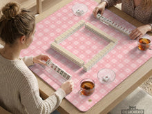 Pink checkered mahjong mat with small hearts and flowers.