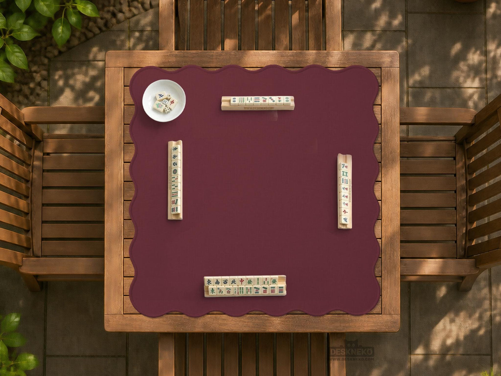 Plain burgundy square mahjong mat with scalloped edges on a white background.