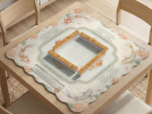 Sage and cream mahjong mat with a koi fish pond pattern, lotus blooms, water ripples, and printed instructions around the border. One version has a scalloped edge.