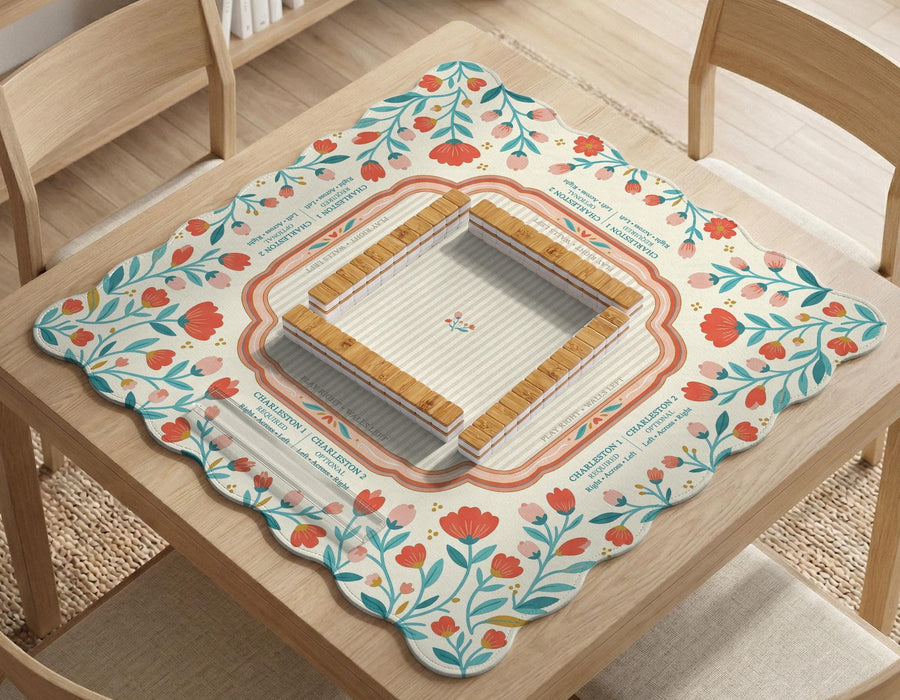 Cream square mahjong mat with coral flowers, teal stems, and a soft scalloped border.