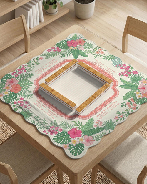 Coral tropical floral mahjong mat with hibiscus flowers, palm leaves, cream sections, and a scalloped edge.