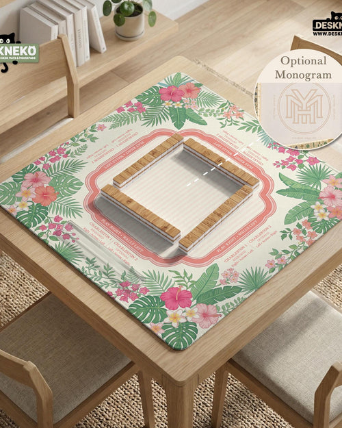 Green square mahjong mat with palm leaves, coral hibiscus flowers, cream rule areas, and printed game layout.
